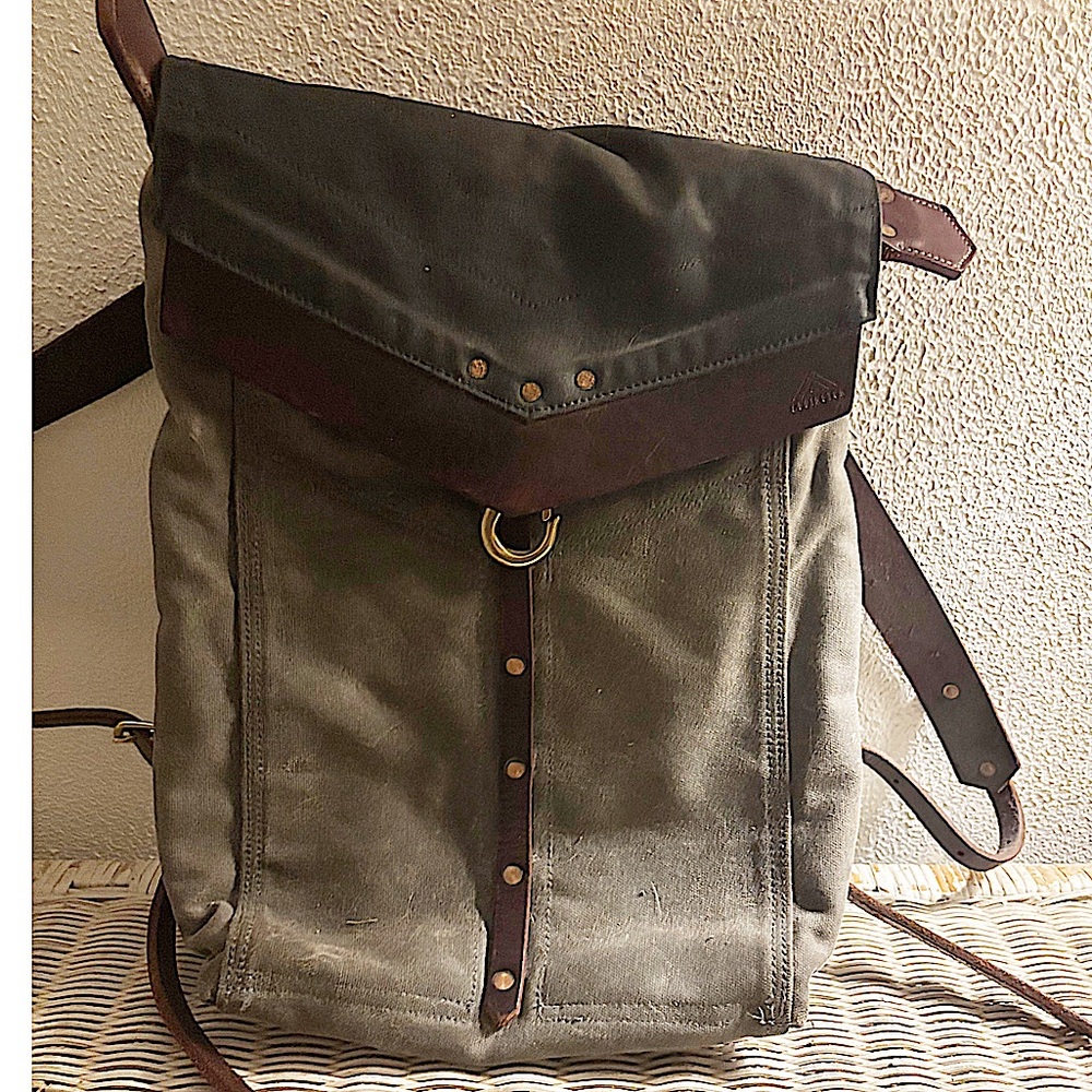 Handcrafted heavy cotton canvas and leather laptop satchel style backpack.